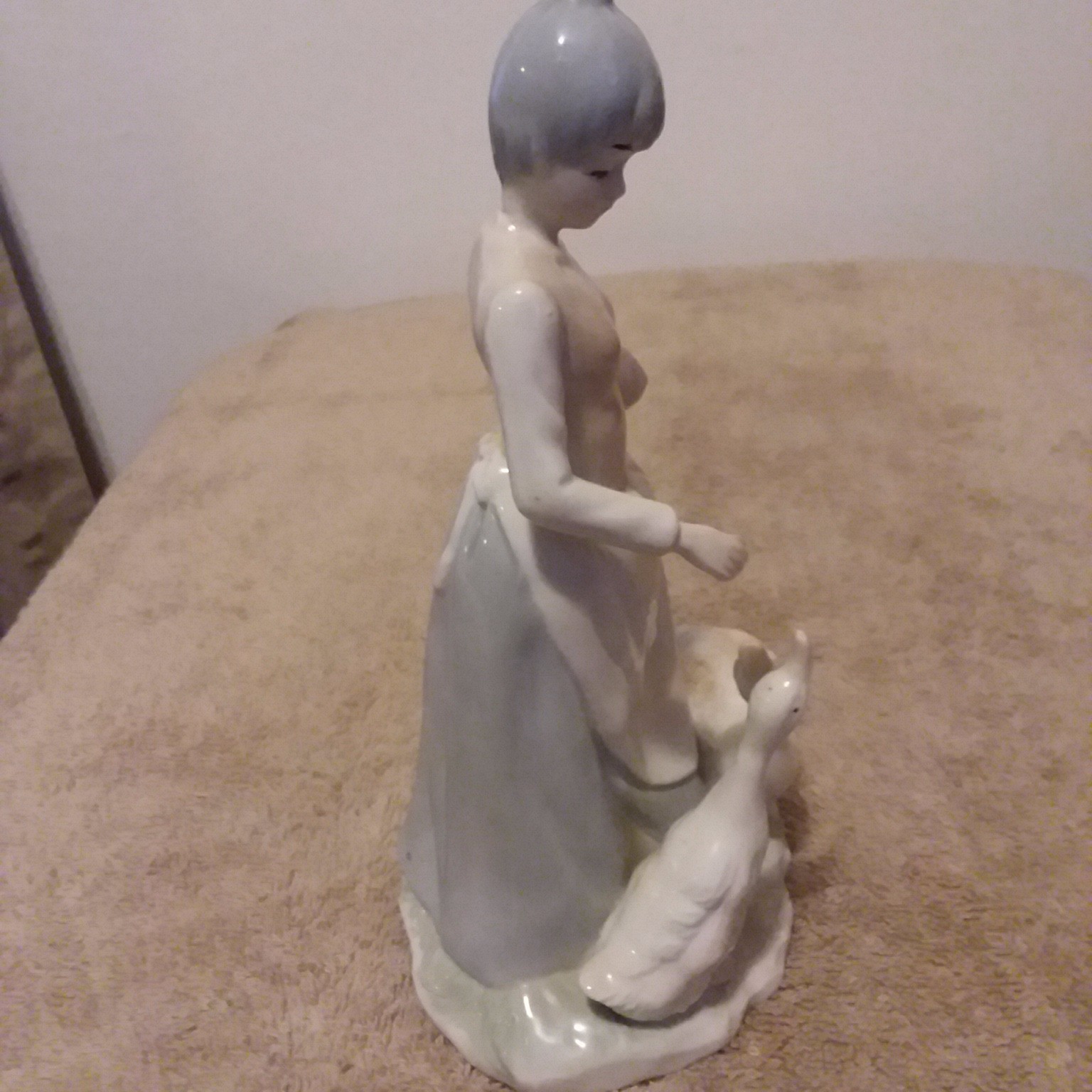 A Beautiful Vintage Lady feeding geese. great condition.