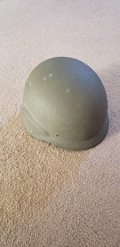 Military plate carrier. With plates and kevlar helmet