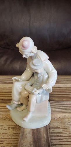Porcelain Clown Figurine with Boy Playing Accordion