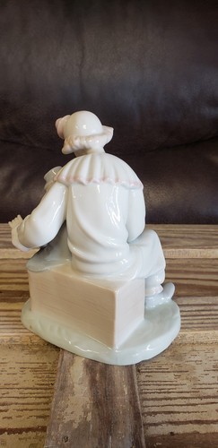Porcelain Clown Figurine with Boy Playing Accordion