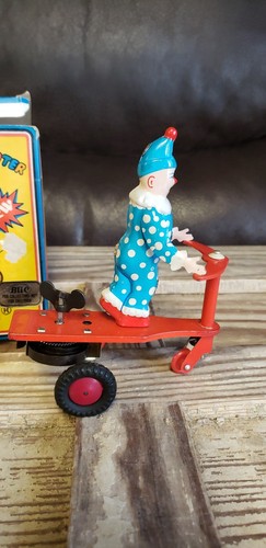 BLIC VINTAGE WIND UP TOY CLOWN RIDING TRICYCLE SCOOTER