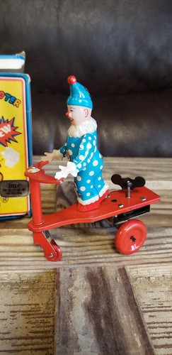 BLIC VINTAGE WIND UP TOY CLOWN RIDING TRICYCLE SCOOTER