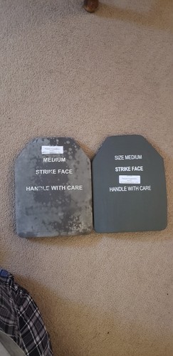 Military plate carrier. With plates and kevlar helmet