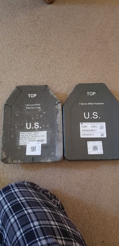 Military plate carrier. With plates and kevlar helmet