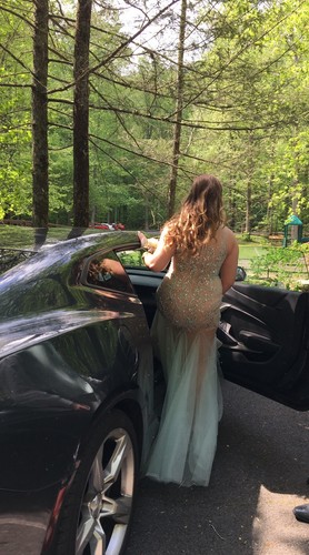 Aqua/teal prom dress size 6. It’s embellished with sequins in various places.