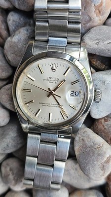 Montre automatique homme vintage Rolex Oyster Perpetual 1500 cadran argenté 1975