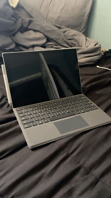 Surface pro 7, 128 GB, 8 GB of ram, comes with pen and charger. 