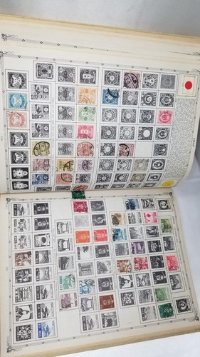 The Coronet Deluxe World Stamp Album with Stamps 1957, some stamps inside