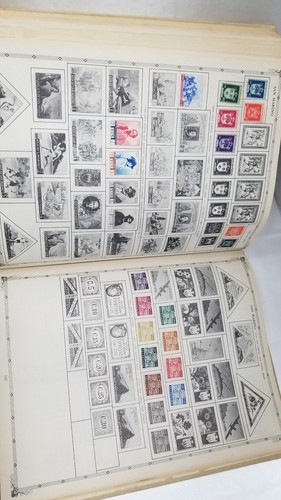 The Coronet Deluxe World Stamp Album with Stamps 1957, some stamps inside