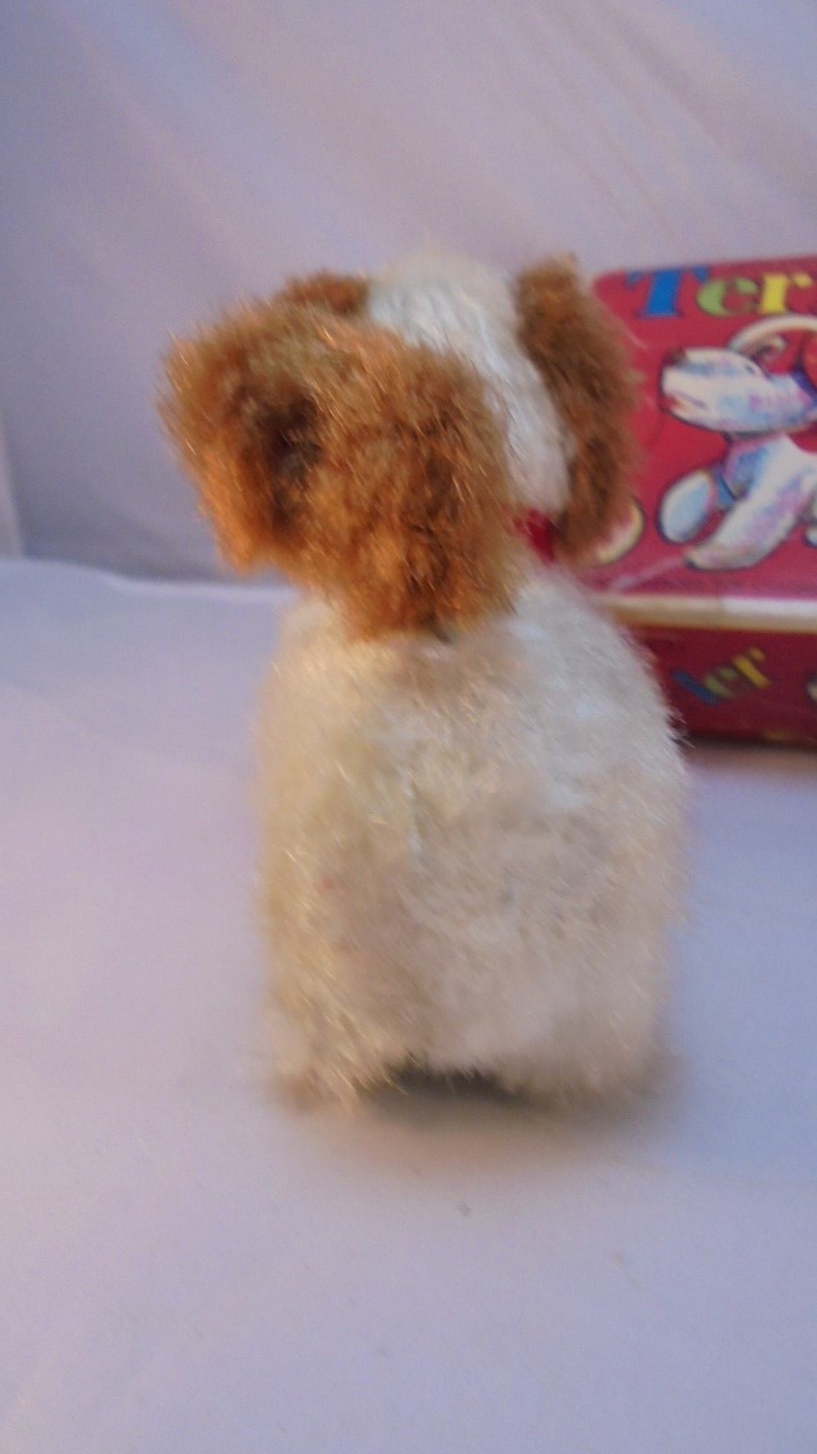 Vintage Mechanical Terrier Wind-up toy dog with spinning tail with original box