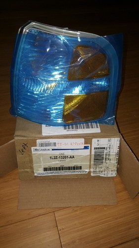 Genuine Ford Park/Turn Lamp 1L2Z-13201-AA. Left side.