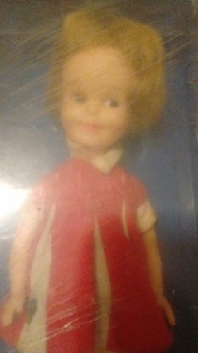 Penny Brite in red dress blue case vintage