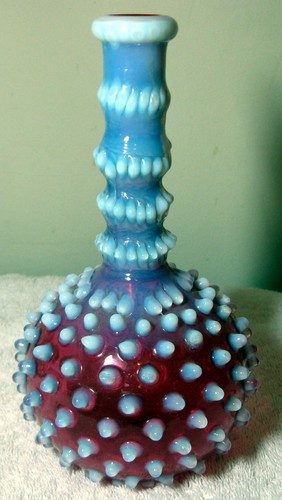 A Nice Antique Cranberry Opelescent Hobnail barber bottle