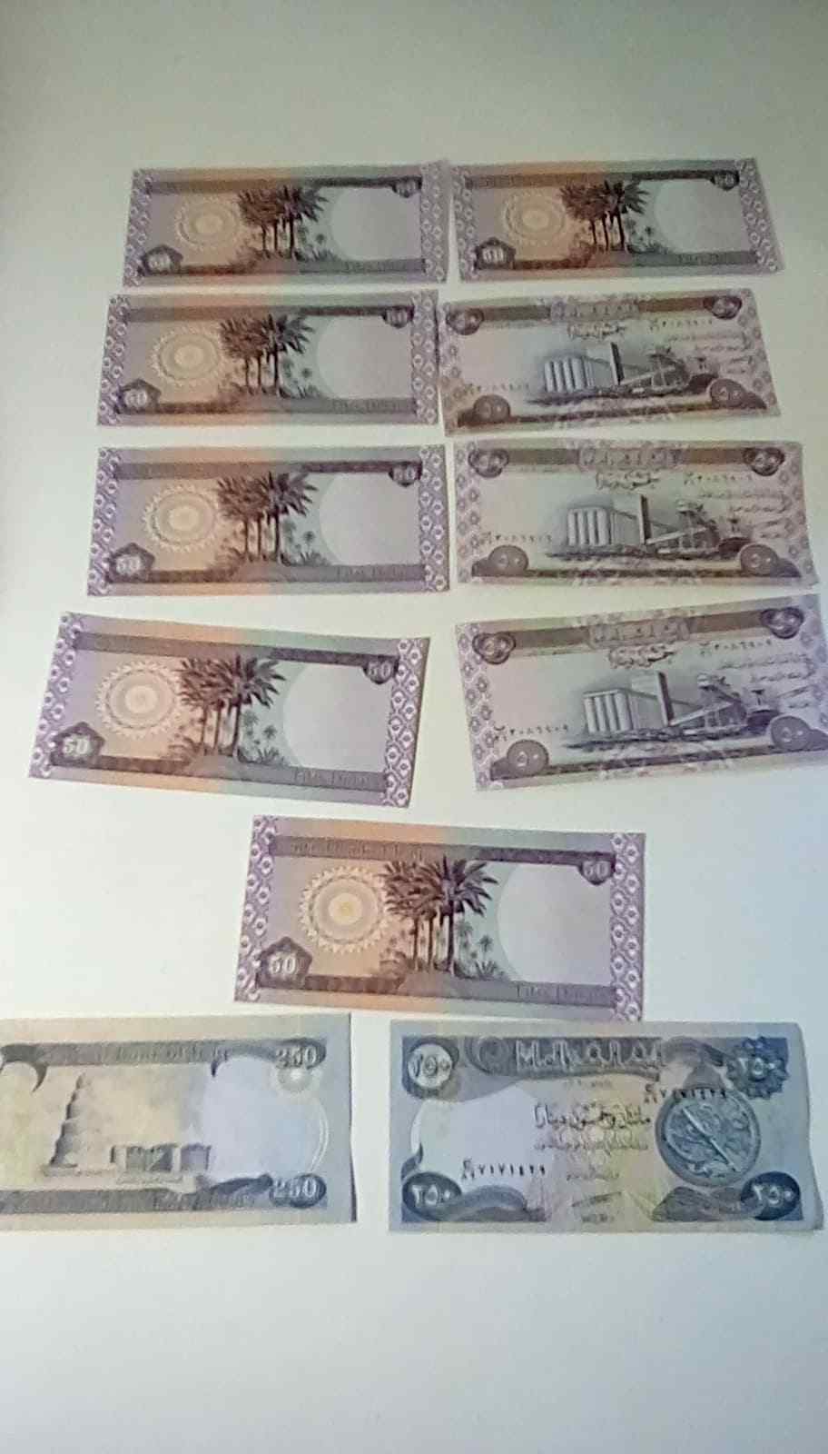 Iraq Dinnar Lot of 5 50 Dinars and 2 250 Dinars