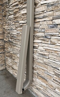 Downspout extension retention clip for flip up hinges of all types