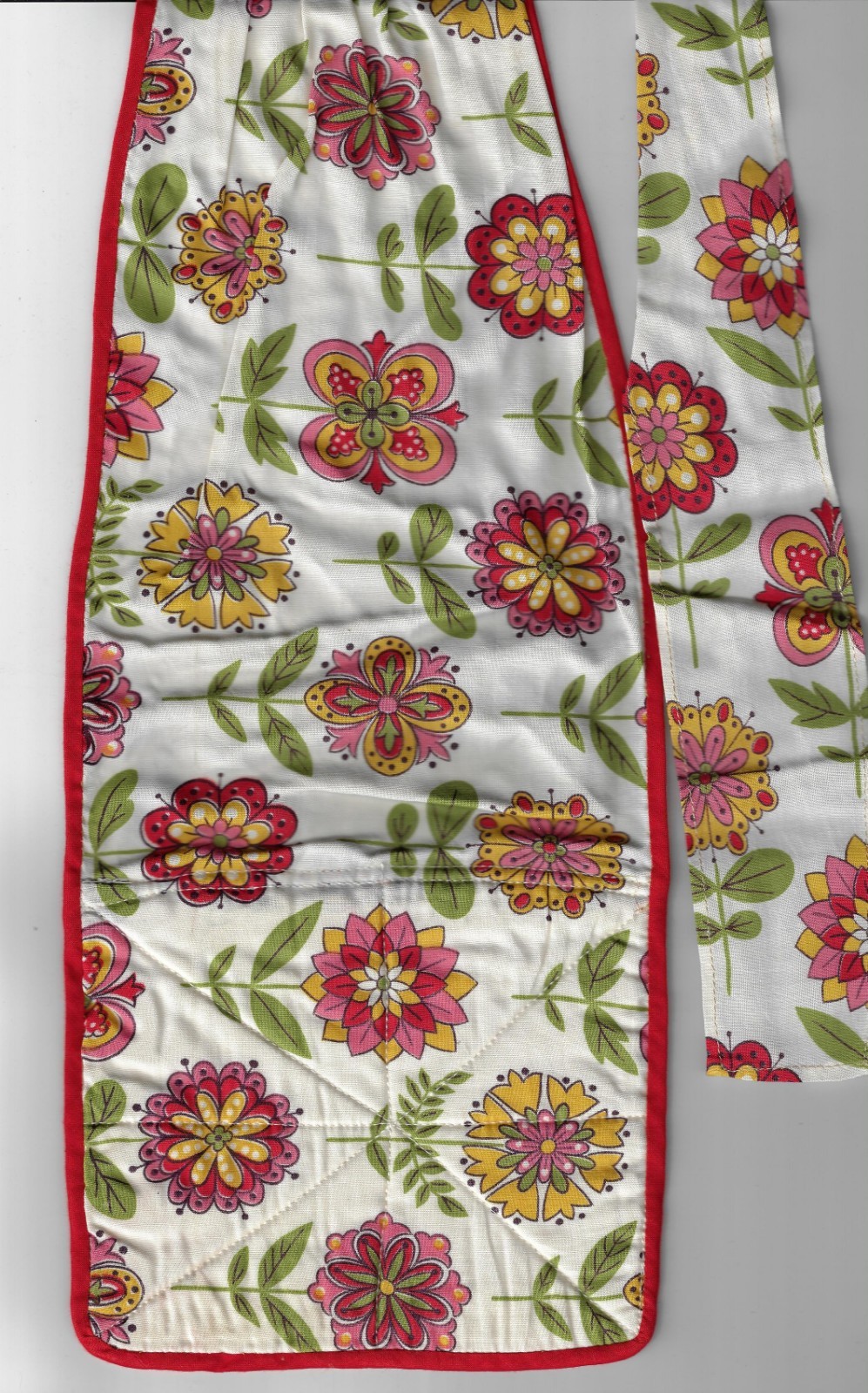 large  half apron with sewn on  pot holders- yellow pink green floral 70's?