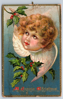 A Joyous Xmas Postcard Embossed Wee Angel and Holly Tuck's DB Posted 1909