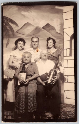 Vtg B&W Snapshot Family Group Giant Novelty Wine Bottles Palm Tree Backdrop
