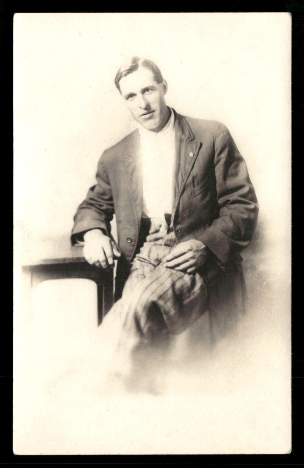 RPPC Postcard Vignette of A Man Sitting at a Table c1910