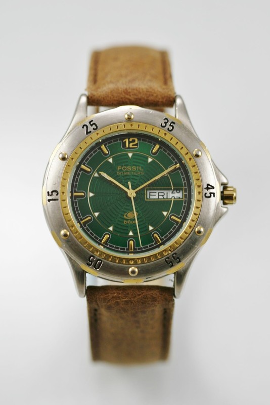 gold and silver fossil watch men's