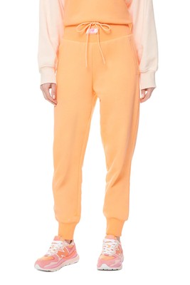 

New Balance Athletics Amplified Fleece Pants Womens Peach Glaze Sweatpants, Оранжевый, New Balance Athletics Amplified Fleece Pants