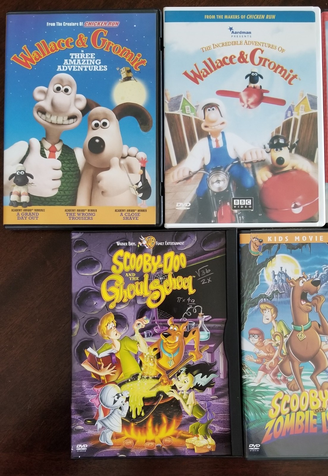 Lot of 7 Children's DVDs 3 Scooby-Doos, 2 Wallace & Gromit, E.T., Polar Prowl
