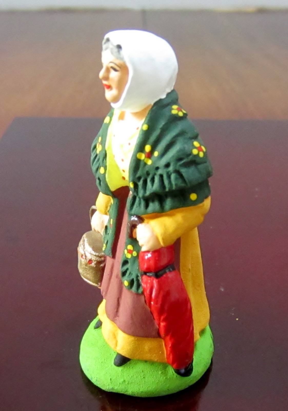New Carbonel French Nativity santon #2 woman with a red umbrella and a heater