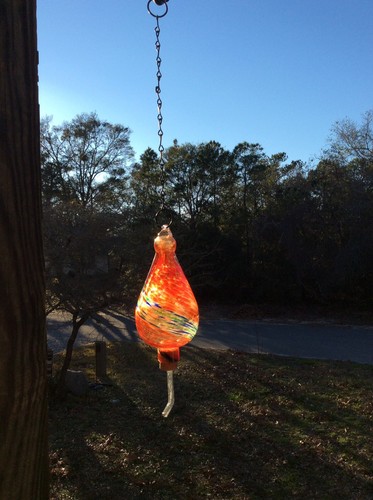 Orange, blue, green glass Hummingbird feeder