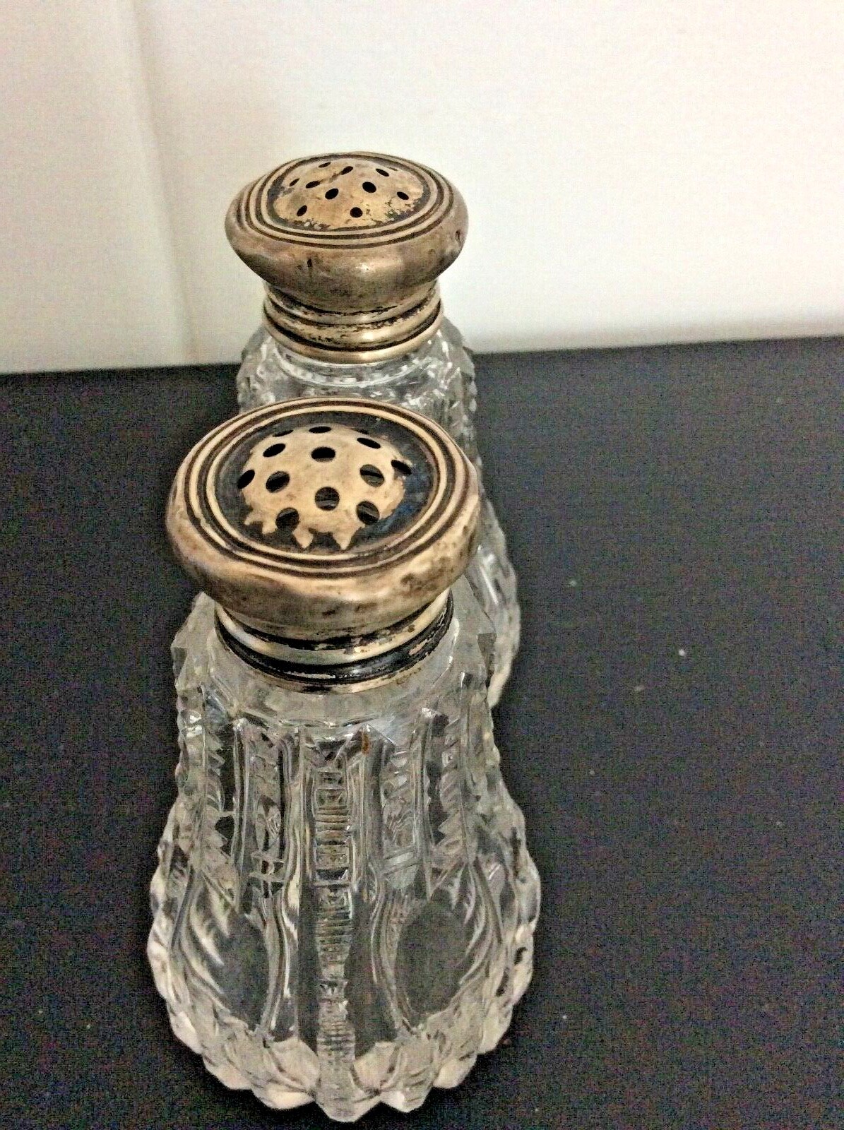 Antique crystal salt and pepper shakers, zipper cut silver lids