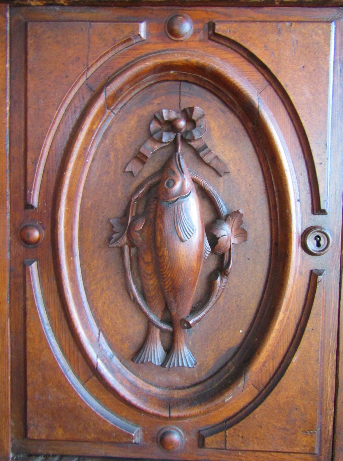 VICTORIAN CHESTNUT HUNTBOARD W CARVED FISH AND BIRDS
