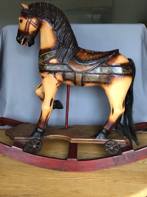 antique hobby horse on wheels