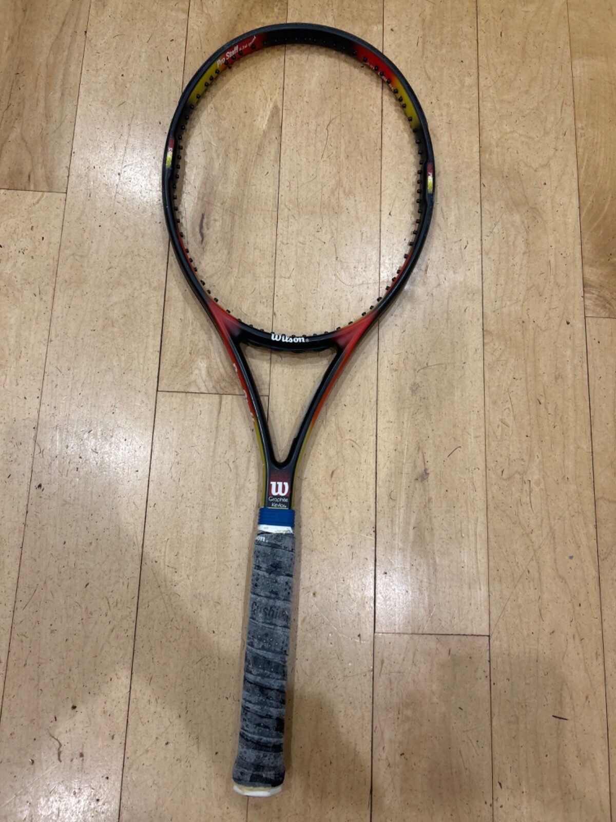 Used black, red, and yellow Wilson Pro Staff 6.1si stretch