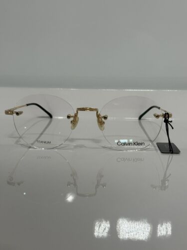 New Calvin Klein CK22112T 717 Shiny Gold Titanium Round New Calvin Klein CK22112T 717 Shiny Gold Titanium Round