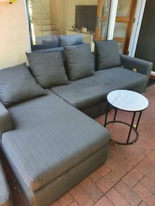 couch shaped outdoor piece grey