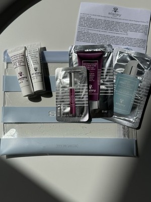 Pochette Sisley + Crema anti age viso 4ml + Crema rimpolpante 4ml + Campioncini