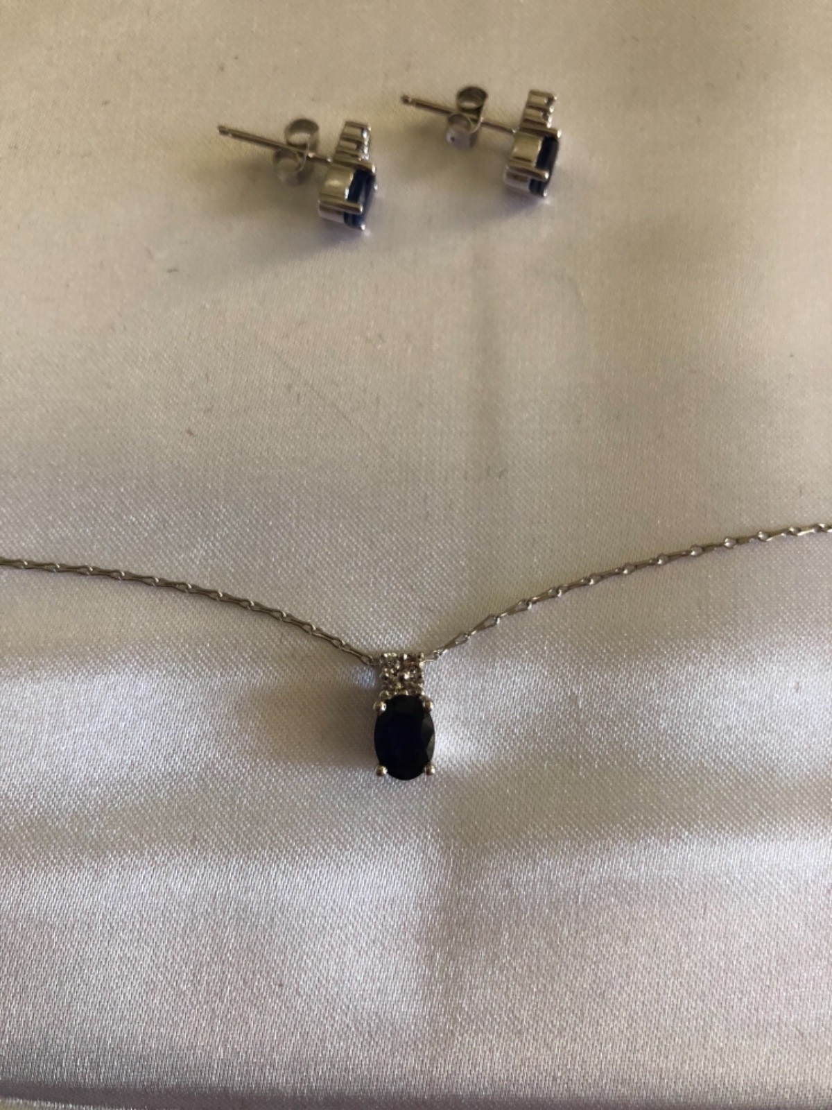 New 14 karat white gold sapphire/diamond pendant earring set