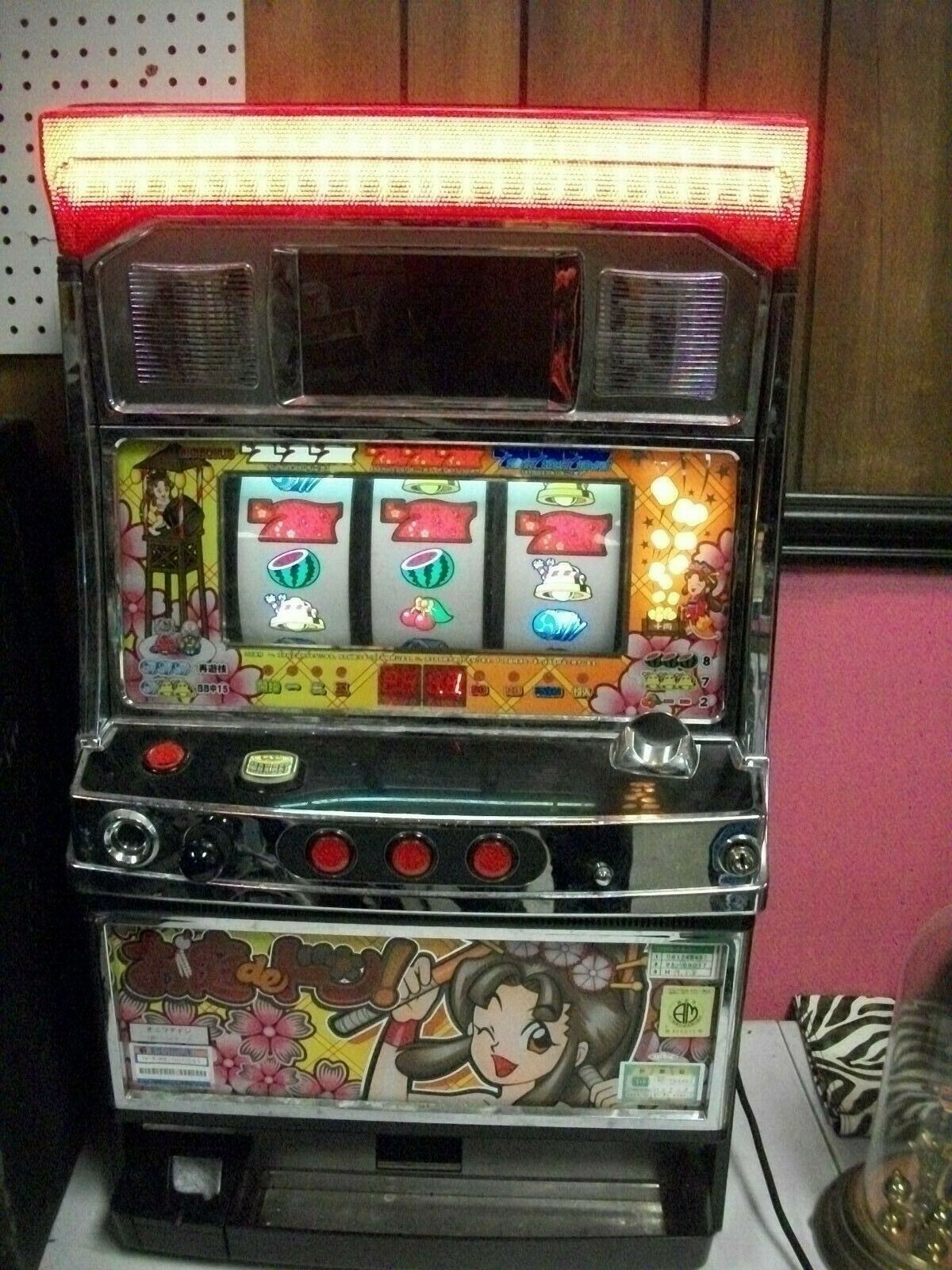 JAPANESE GAME MACHINE TOKENS ONLY IT LIGHTS UP STILL SELL AS IS I DONT HAVE TOKE