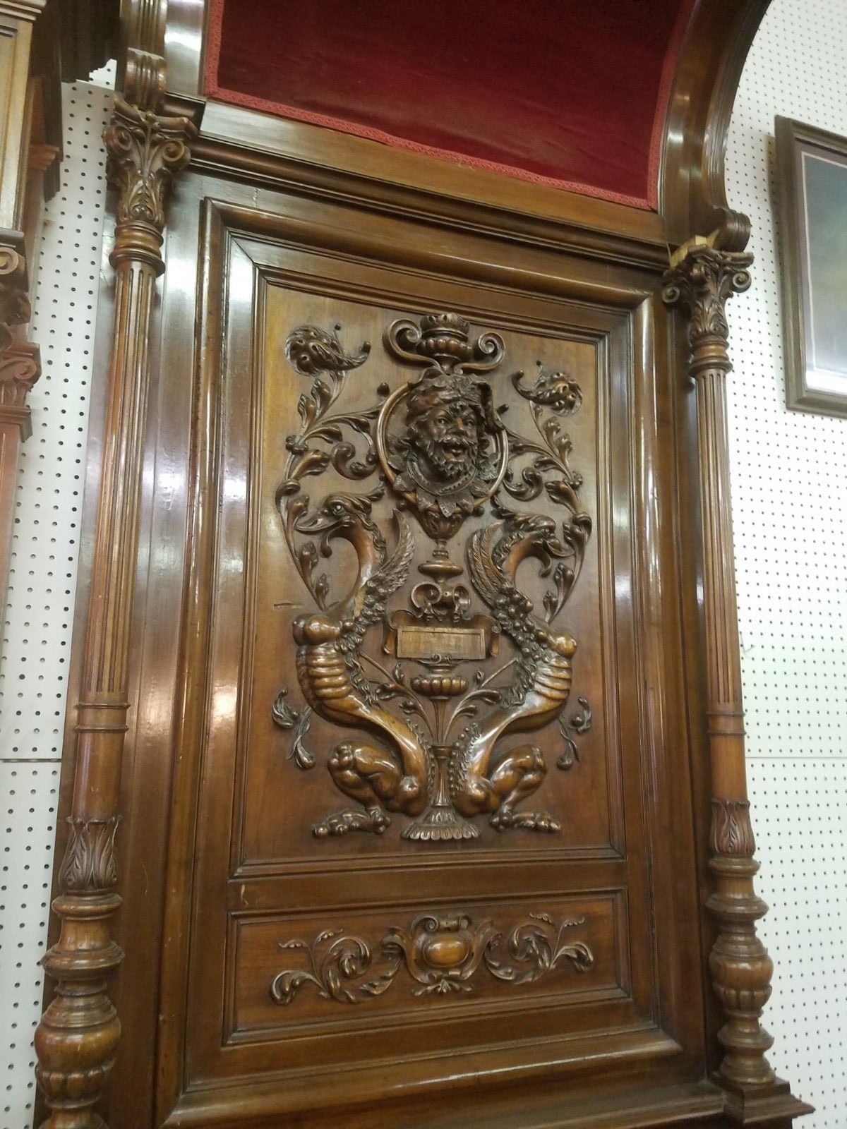 11' tall Griffin chairs heavily carved.