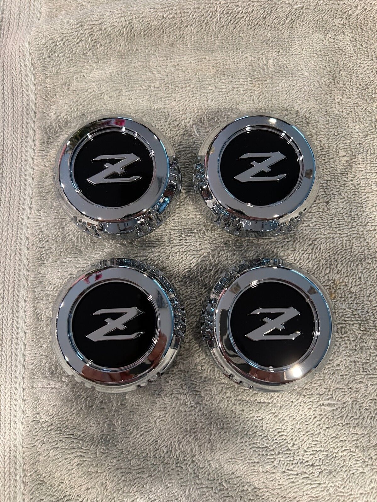 DATSUN 280Z/ZX BRAND NEW OEM SET OF 4 WHEEL CENTER CAPS DATSUN 280Z/ZX BRAND NEW OEM SET OF 4 WHEEL CENTER CAPS