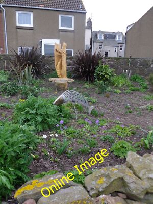Photo 12x8 A seaside garden, Stonehaven With local artefacts - a leaping s c2014