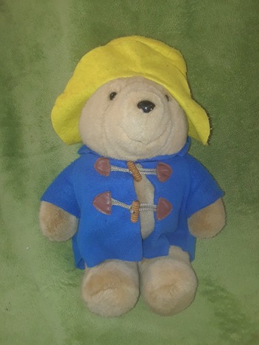 Peluche hochet ours Paddington Bear manteau bleu chapeau jaune EDEN