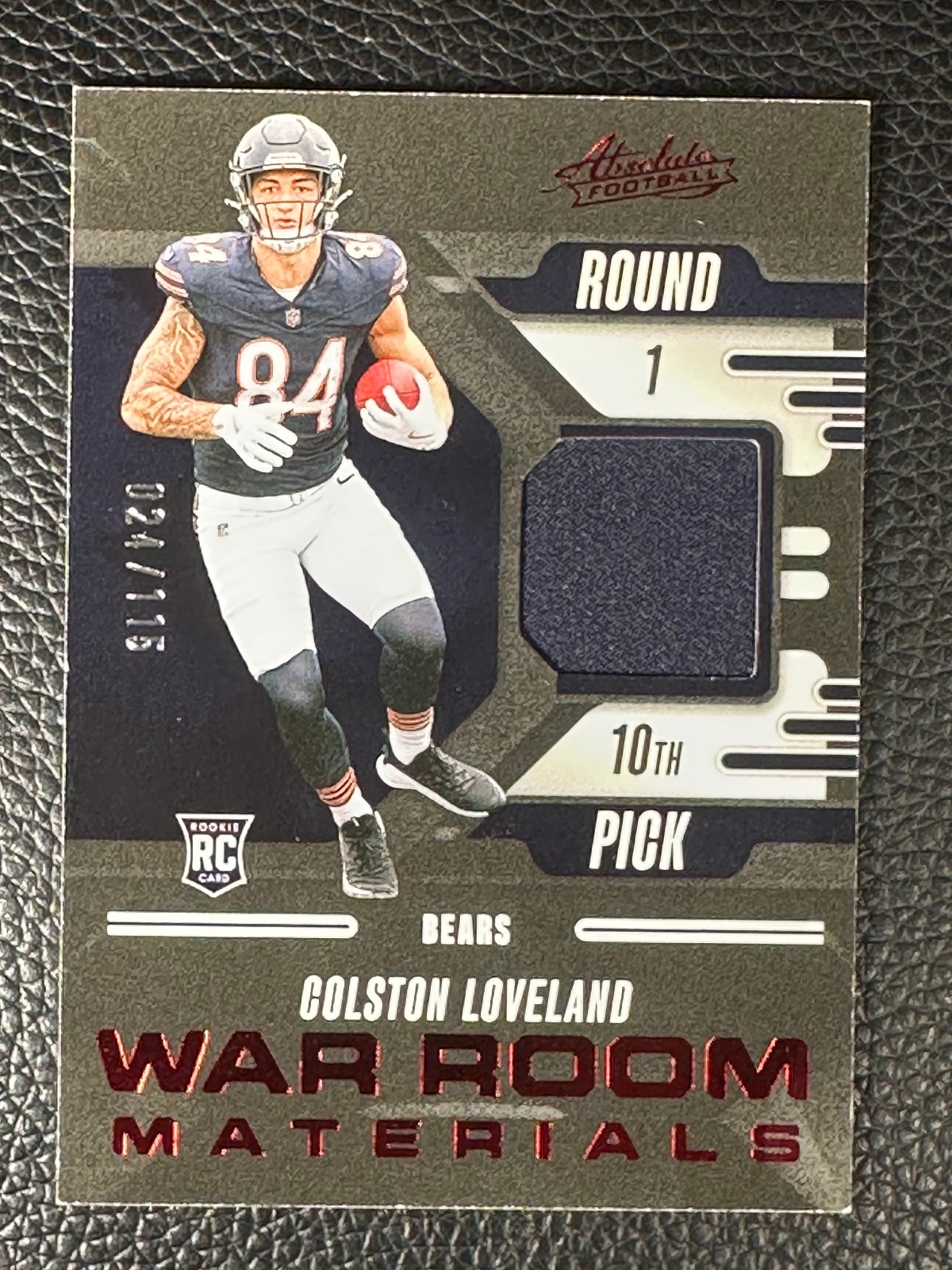 2025 Panini Absolute War Room Materials Red Colston Loveland 24/115 Jersey RC