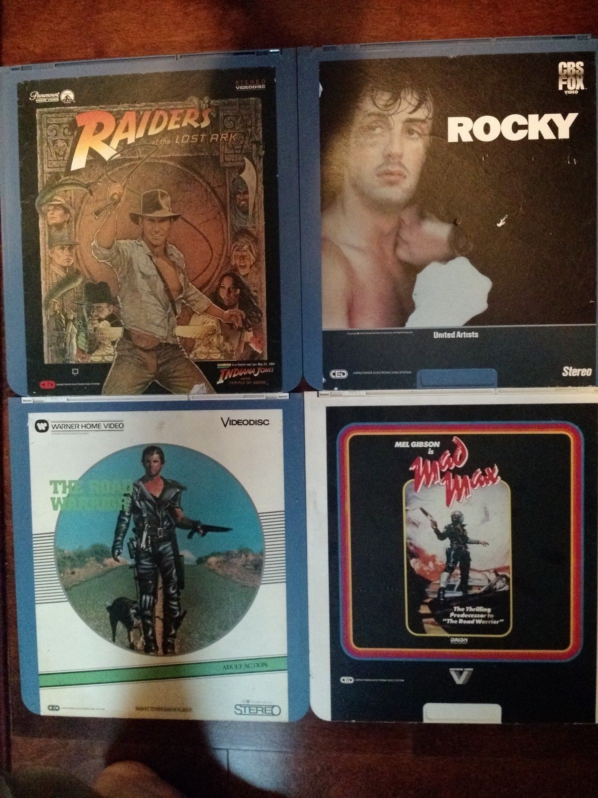 4 LOT CED VIDEODISC  ROCKY, MAD MAX, & THE ROAD WARRIOR, RAIDERS OF THE LOST ARC