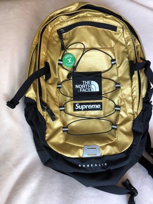 gold supreme north face backpack