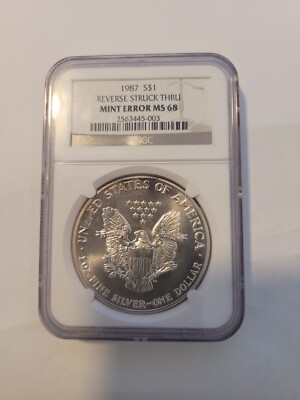 Rare! 1987 Silver Eagle NGC MINT ERROR MS 68 Reverse Struck Thru
