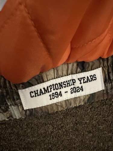 SUPREME SUPREME MITCHELL & NESS NCAA HOODED STADIUM JACKET WOODLAND CAMO SMALL CONFIRMED