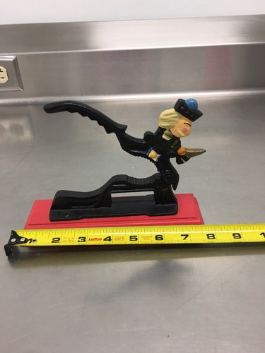 CAST IRON NUTCRACKER, SOLDIER ON RED WOOD BASE