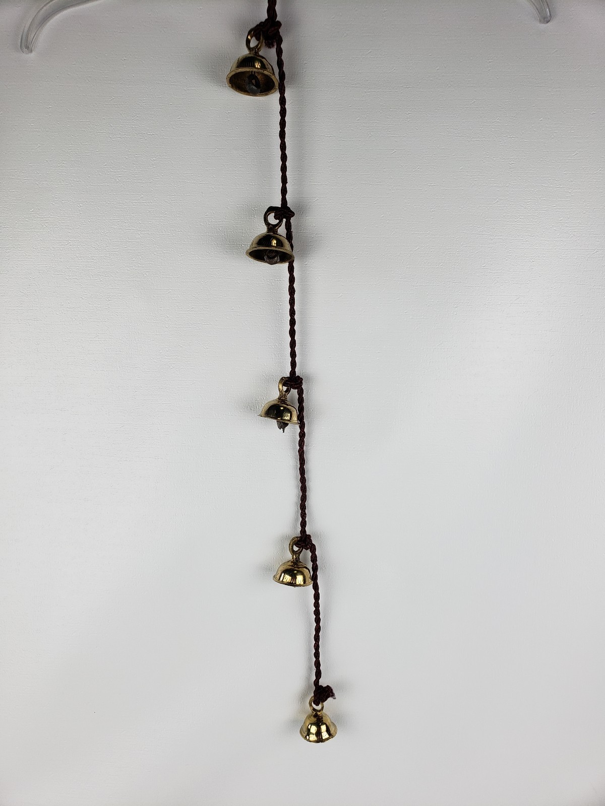 5 Brass Bells Strung on a Brown Rope India Same Shape Different Sizes