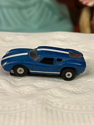 Aurora Thunderjet T-Jet HO Scale Slot Car:  Lola Tuff Ones Blue w/White Stripe