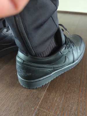 jordan 1 low triple black on feet
